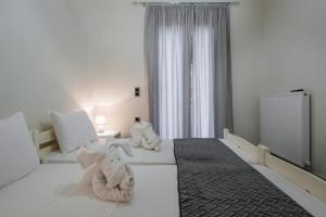 Posteľ alebo postele v izbe v ubytovaní Cataleya Villa Chania