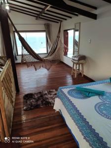 Ένα ή περισσότερα κρεβάτια σε δωμάτιο στο Casa Brisa do Mar Canoa Quebrada