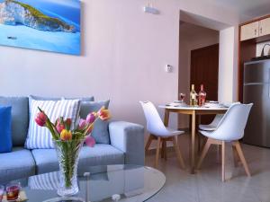 a living room with a couch and a table at Blue Lagoon Luxury Apartment A1 in Argostoli