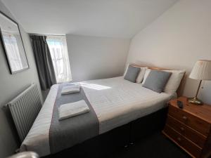 Postel nebo postele na pokoji v ubytování Apollo Hotel Kings Cross