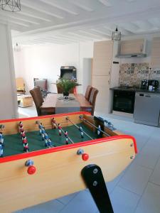 a living room with a pool table with balls on it at LE COCOON D'ANNABELLE - JOLIE MAISON avec JEUX ET GRAND JARDIN in Pierrefitte-sur-Sauldre