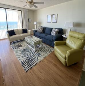 a living room with a couch and a table at Shoalwater 604 Condo in Orange Beach