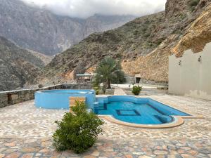 Bazén v ubytování Tilal Al-Qattara nebo v jeho okolí