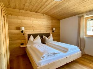 Letto o letti in una camera di Chalet Tuxer