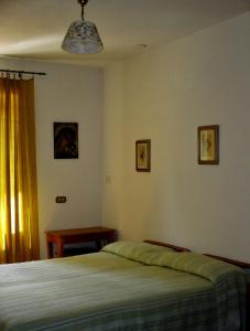 Giường trong phòng chung tại Affittacamere DaMammaSara