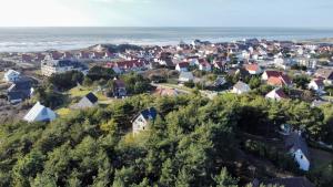 an aerial view of a small town next to the ocean at La villa dans les pins in Quend