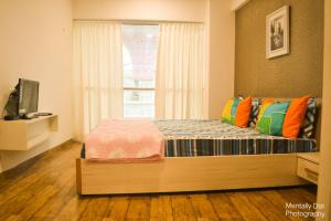 Llit o llits en una habitació de 7 star Weekend studio at Rajhans Belliza by Global Hospitality