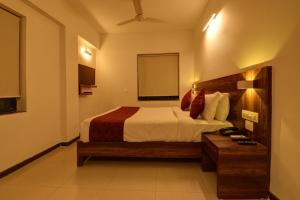 Tempat tidur dalam kamar di SRTC Hotel Aspire