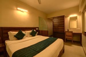 Tempat tidur dalam kamar di SRTC Hotel Aspire