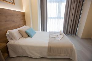 Posteľ alebo postele v izbe v ubytovaní Hotel Boutique O Náutico Laxe