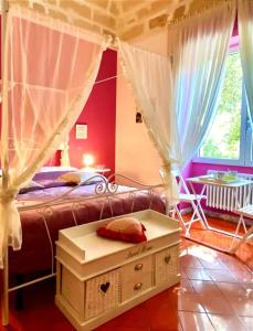 Postel nebo postele na pokoji v ubytování Aedes B&B Il Giardino dei Sogni