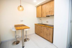 Kuchyňa alebo kuchynka v ubytovaní Hotel Boutique O Náutico Laxe
