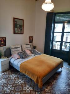 a bedroom with a large bed with pillows on it at Pension Jean Franco room Dylano in Purchena