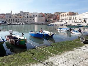 a group of boats are docked in a harbor at La Dimora del Porto in Bisceglie