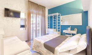 Postel nebo postele na pokoji v ubytování Hotel La Nidiola + 37 fotografií