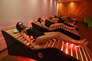 a group of people laying on beds in a room at Balneario de Ledesma in Vega de Tirados