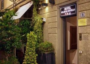 a sign on the side of a building with plants at Hotel Relais Il Cestello in Florence