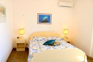 Postel nebo postele na pokoji v ubytování Bluvacanze Corallo P1