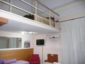 TV a/nebo společenská místnost v ubytování I Papiri B&B Aparthotel