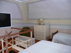 Postel nebo postele na pokoji v ubytování I Papiri B&B Aparthotel + 37 fotografií