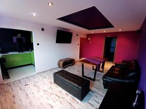 a living room with a couch and a table at Nastrojowe Mieszkanie Plac Krakowski Gliwice 60m2 in Gliwice +42 photos
