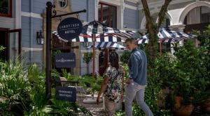 a man and a woman standing under an umbrella at Labotessa Boutique Hotel in Cape Town