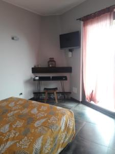 Televízia a/alebo spoločenská miestnosť v ubytovaní B&B nido sul mare