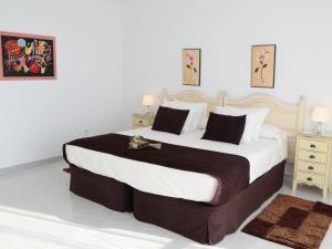 Katil atau katil-katil dalam bilik di Casa Maria o Grove