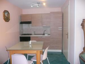 Kuchyň nebo kuchyňský kout v ubytování I Papiri B&B Aparthotel