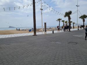 a street with people walking on the beach at Hany apartment Ducado 2-I in Benidorm