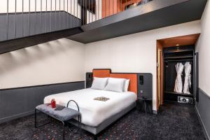 Ένα ή περισσότερα κρεβάτια σε δωμάτιο στο Mercure Bordeaux Centre Gare Atlantic +104 φωτογραφίες