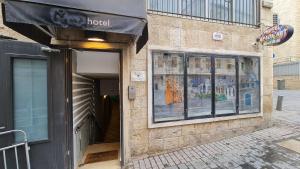 a store with an awning on the side of a building at SPACE ART BOUTIQUE Downtown in Jerusalem