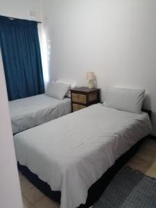 En eller flere senge i et værelse på 23 Villa Mia St Lucia