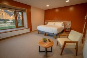 Postel nebo postele na pokoji v ubytování Calafate Apart Hotel