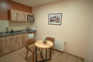 Kuchyň nebo kuchyňský kout v ubytování Calafate Apart Hotel