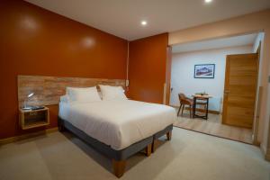 Postel nebo postele na pokoji v ubytování Calafate Apart Hotel
