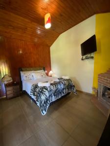 Ein Bett oder Betten in einem Zimmer der Unterkunft Pousada VISTA LINDA