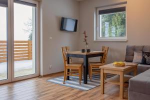 Et opholdsområde på Osada Wróblonki - Apartamenty