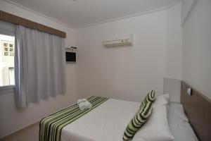 Cama ou camas em um quarto em Pousada Villa Maciel