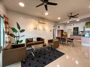 a living room with a couch and a table at Maison life 小居屋 The Loft Imago in Kota Kinabalu