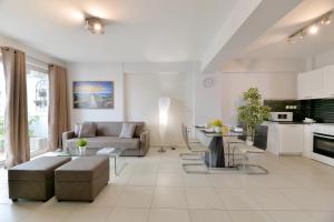 a living room with a couch and a table at Alekos Apartments 1 Νetflix in Athens