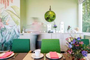 Restoran või mõni muu söögikoht majutusasutuses Hotel am Zoo