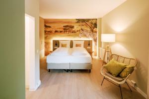 Voodi või voodid majutusasutuse Hotel am Zoo toas