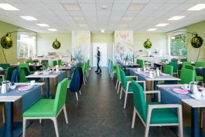 Restoran või mõni muu söögikoht majutusasutuses Hotel am Zoo