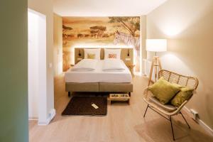 Voodi või voodid majutusasutuse Hotel am Zoo toas