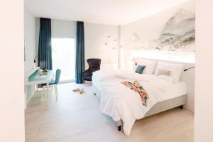 Voodi või voodid majutusasutuse Hotel am Zoo toas