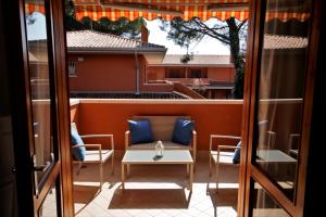 a view of a patio with a table and chairs at Sa di Mare in Bibione