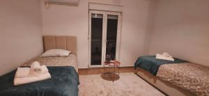 Llit o llits en una habitació de Auto kamp Titograd