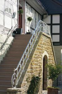 a stairway leading to a staircase leading to a balcony at Schiefer Hotel in Goslar
