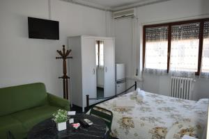 A bed or beds in a room at B&B La Cubanina